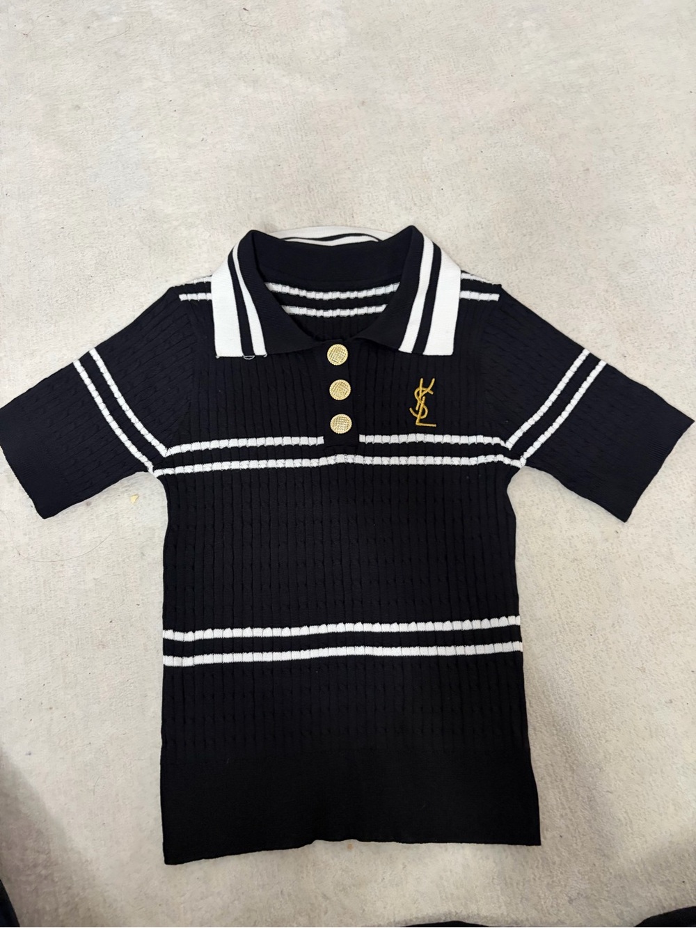 A Black Top with White Stripes and Gold Buttons/Unbranded with S size/ 11x19in